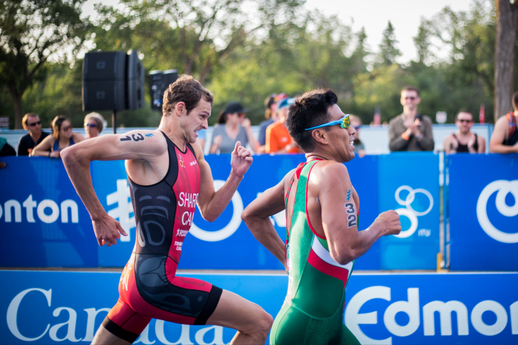 two athletes that are running in a triathlon race